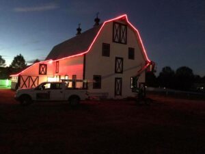 Barn with red lights around it